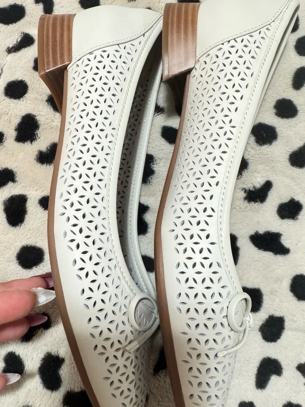 Comfortiva White Laser-Cut Bow Ballet Flats
